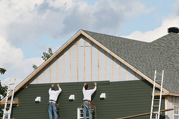 Professional Storm Damage Siding Repair technician working in Clarksburg, OH